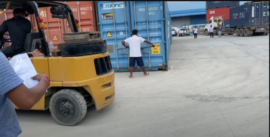 Unloading 3 cars for cambodian customers